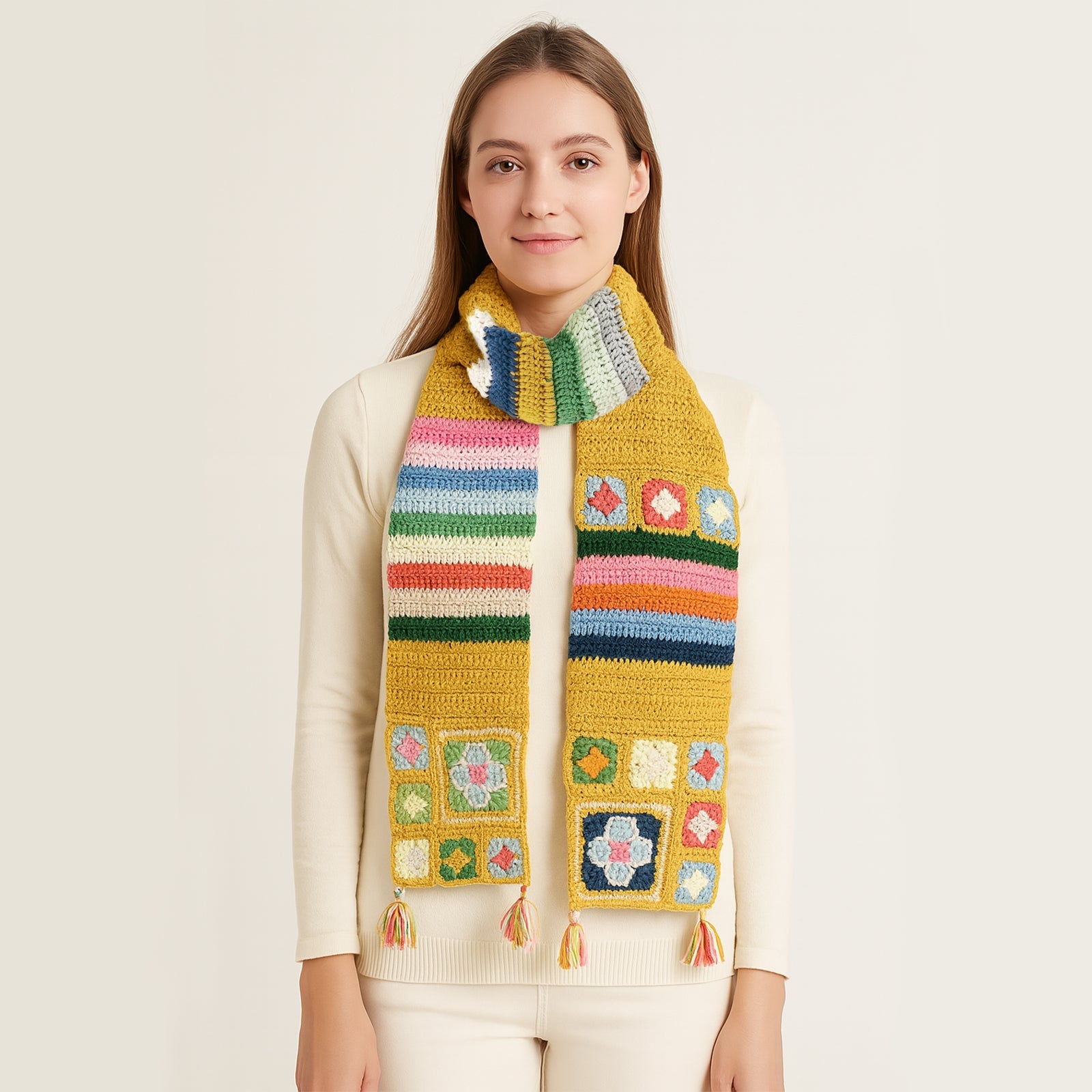 Woman crocheting a golden granny square scarf and close-up details of the colorful squares and tassels