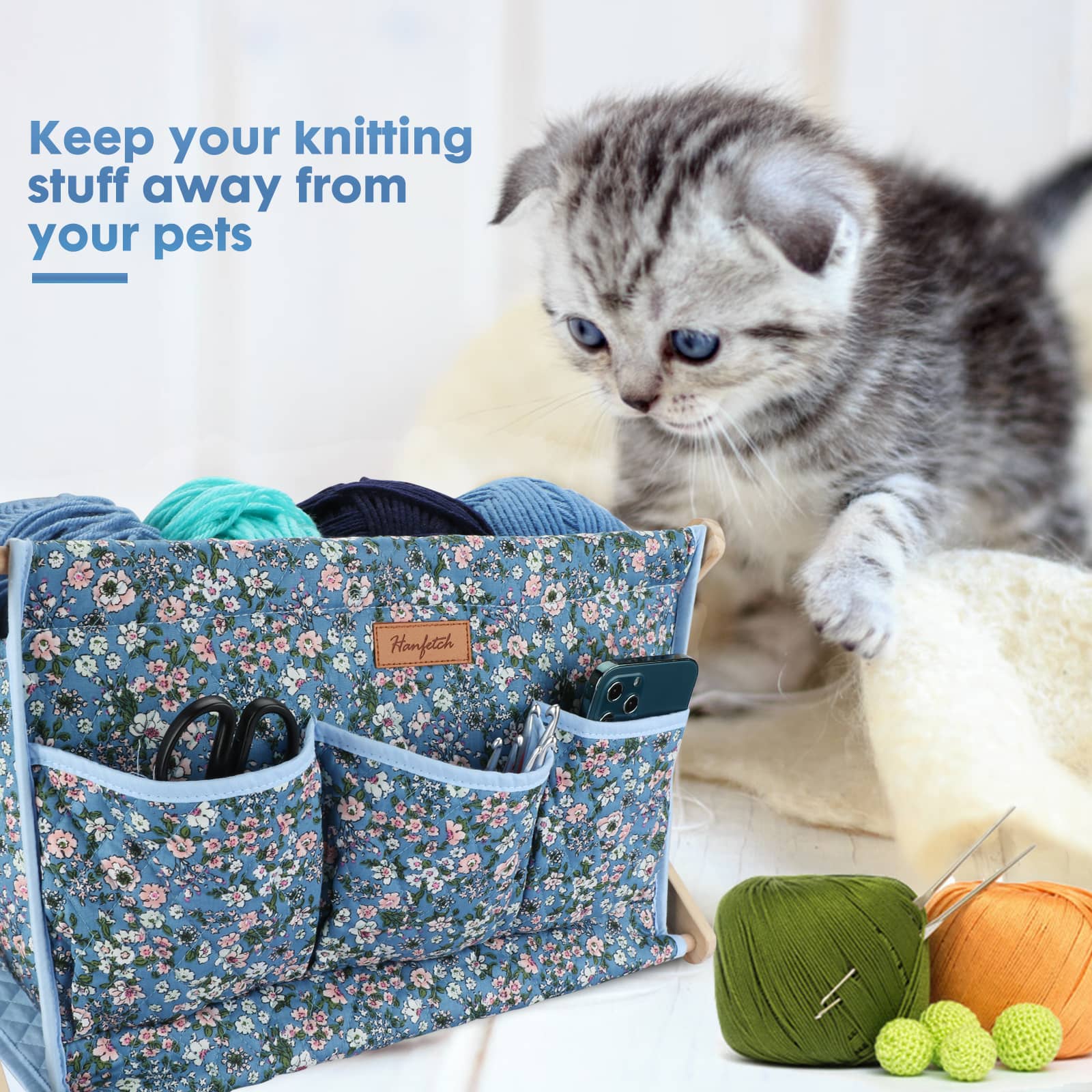 Woolique blue floral-patterned craft organizer with yarn, tools, and a playful kitten, promoting pet-safe knitting supplies storage