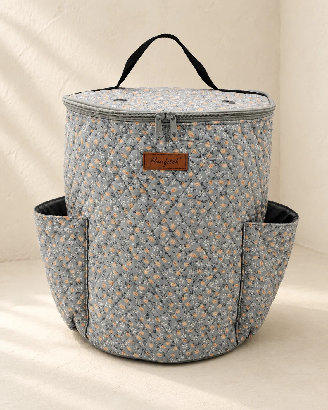 Woolique cylindrical yarn storage bag with a compact upright shape