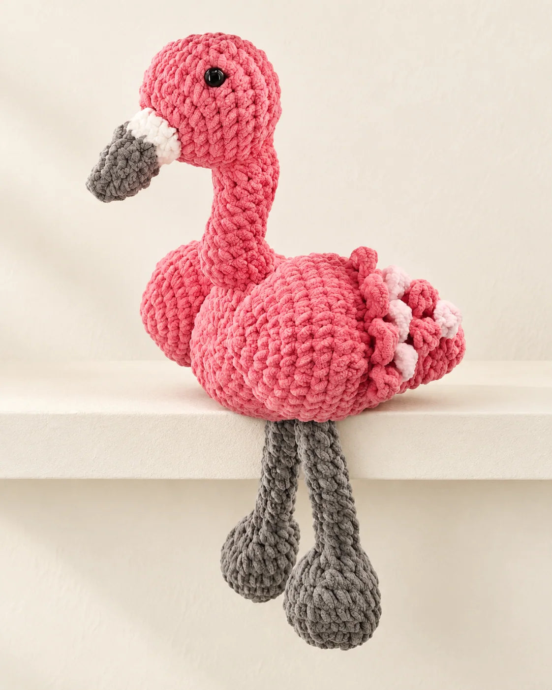 Pink flamingo amigurumi design made with plush chenille yarn