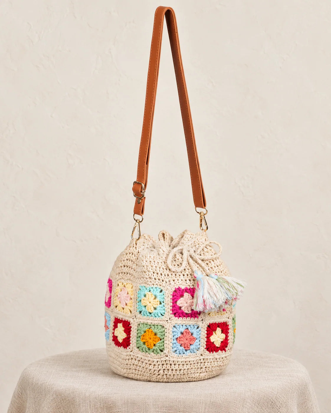 Granny square crochet bucket bag design in an earthy colour palette