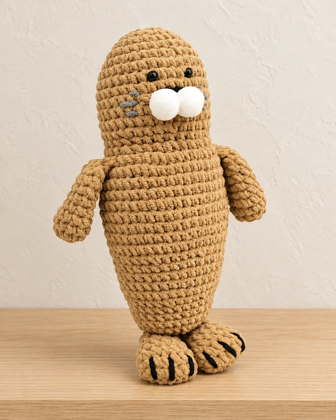 Hugging seal amigurumi design with a plush chenille yarn surface