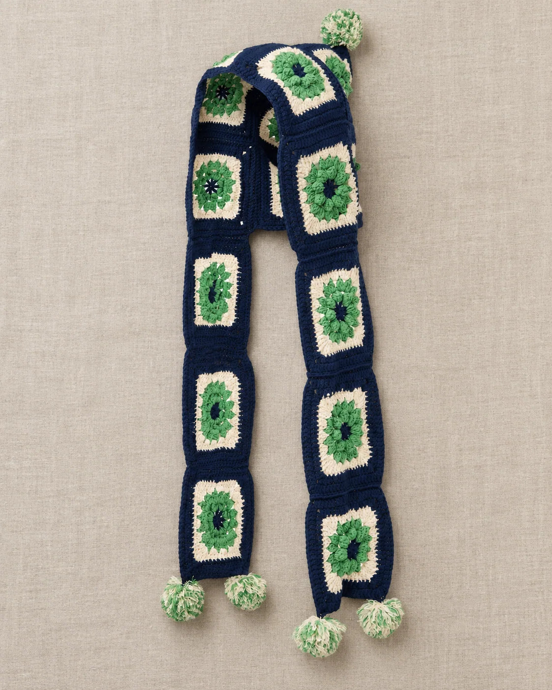 Granny square crochet scarf hood design with pom pom finishing details