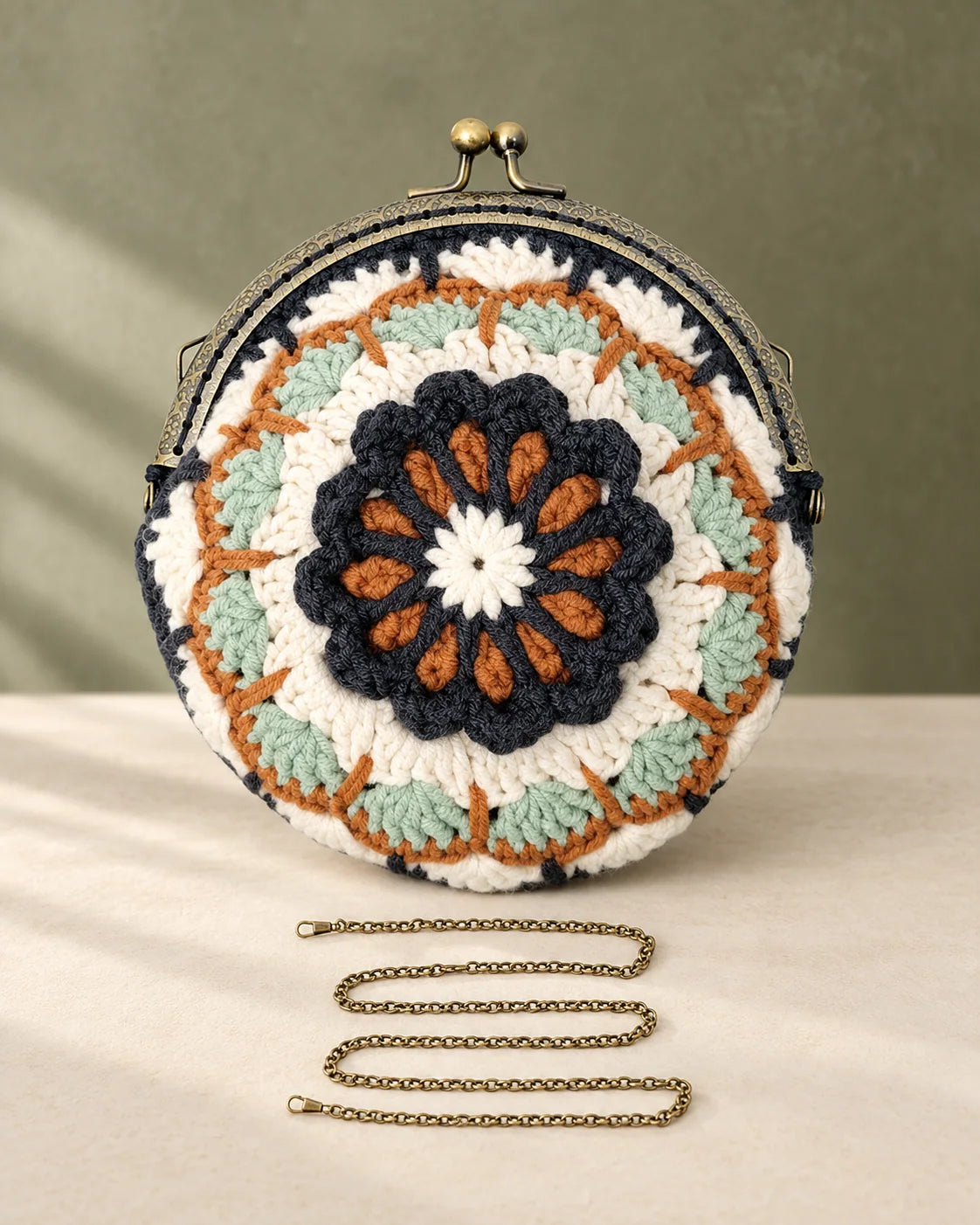 Mandala crochet purse design with antique style kiss clasp and metal chain